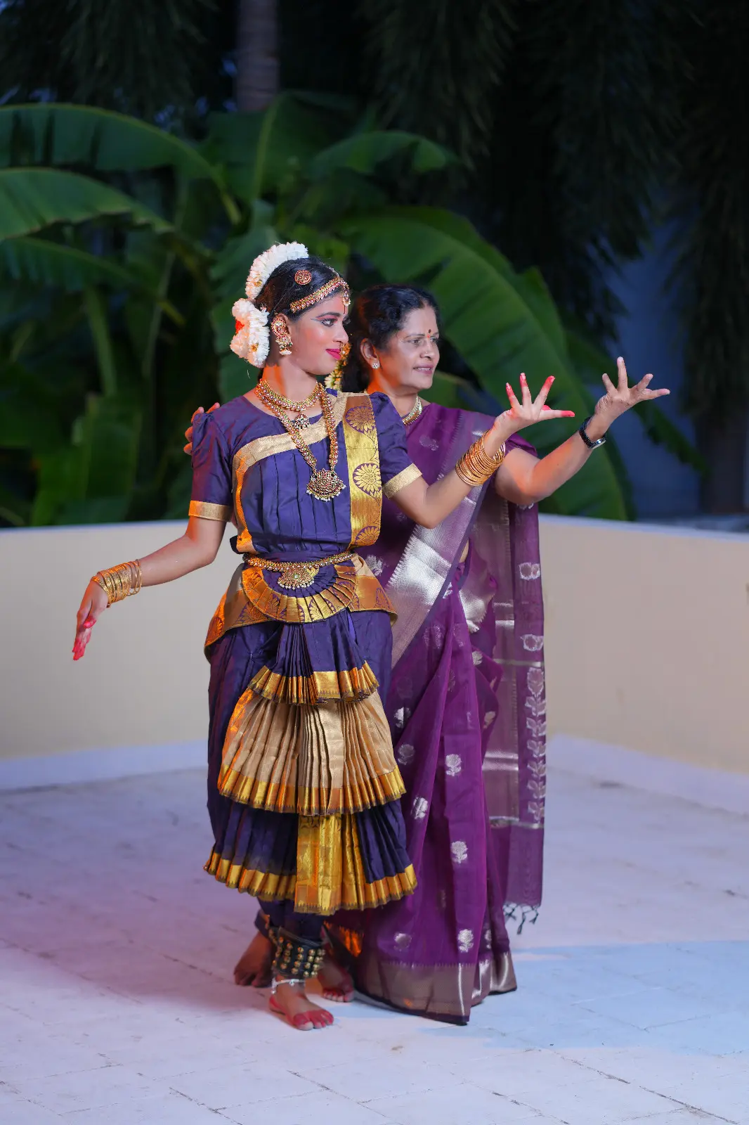 Guru guiding a Bharatanatyam student